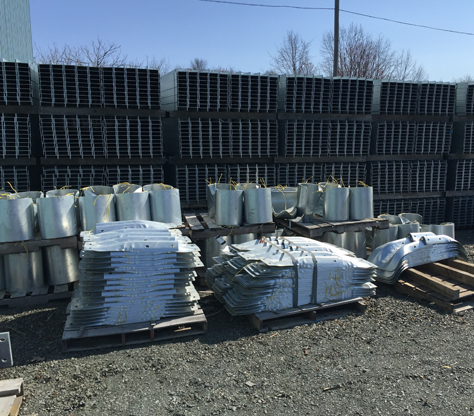 Steel posts for highway guardrails